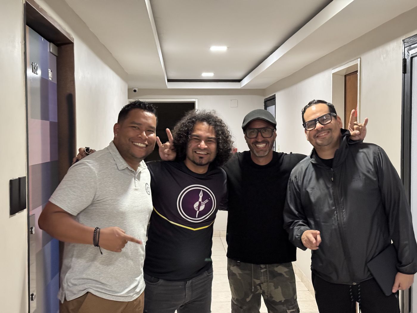Juan Balza con tres colegas y aliados de trabajo